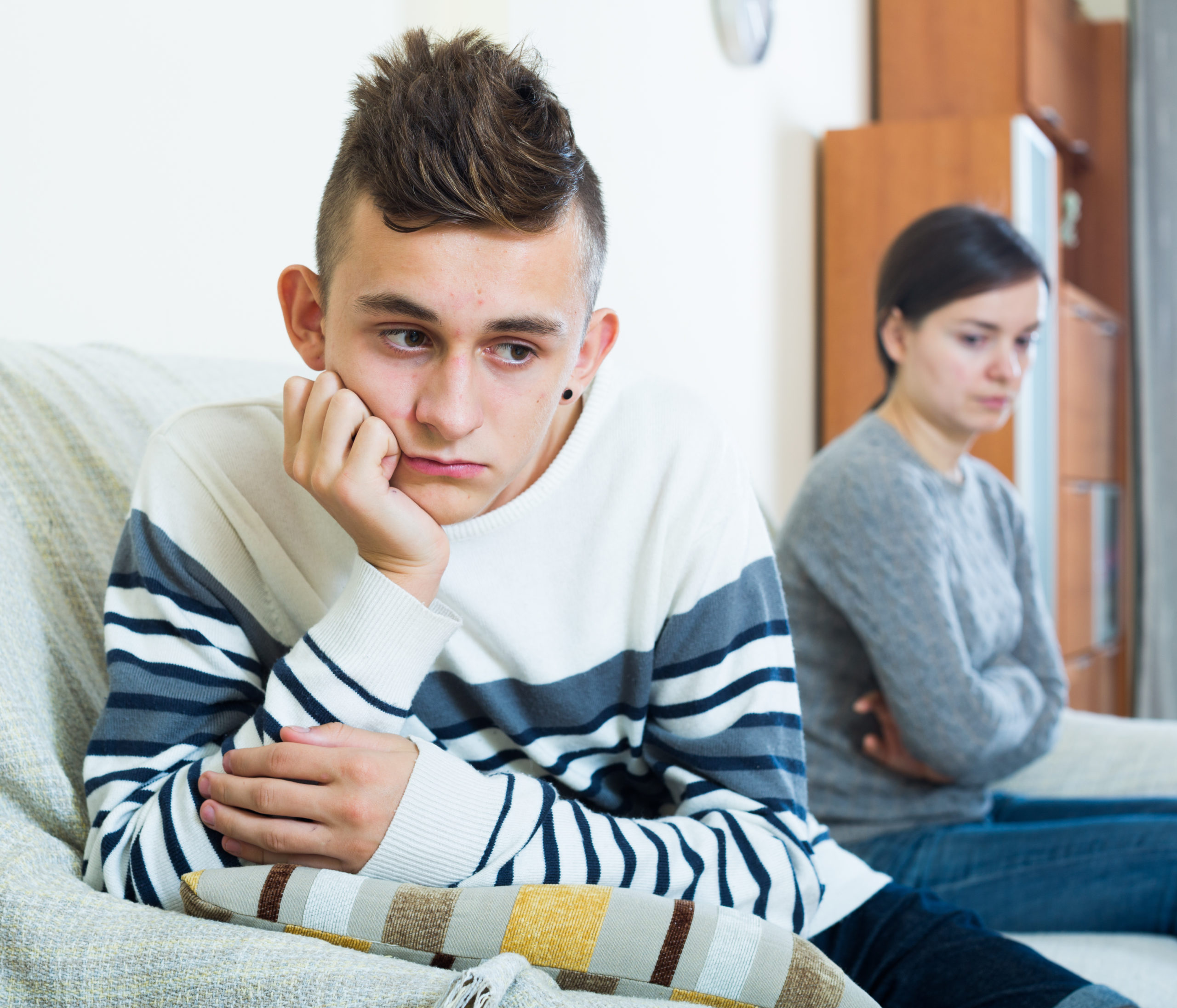 Frustrated  mother and angry teen quarrelling  in domestic inter