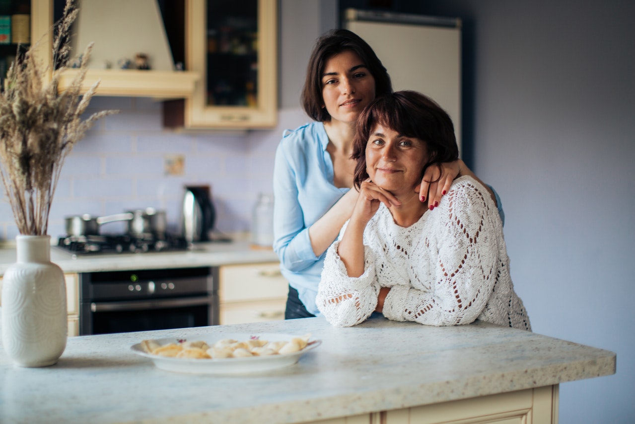 two-adult-women-blue-shirt-and-white