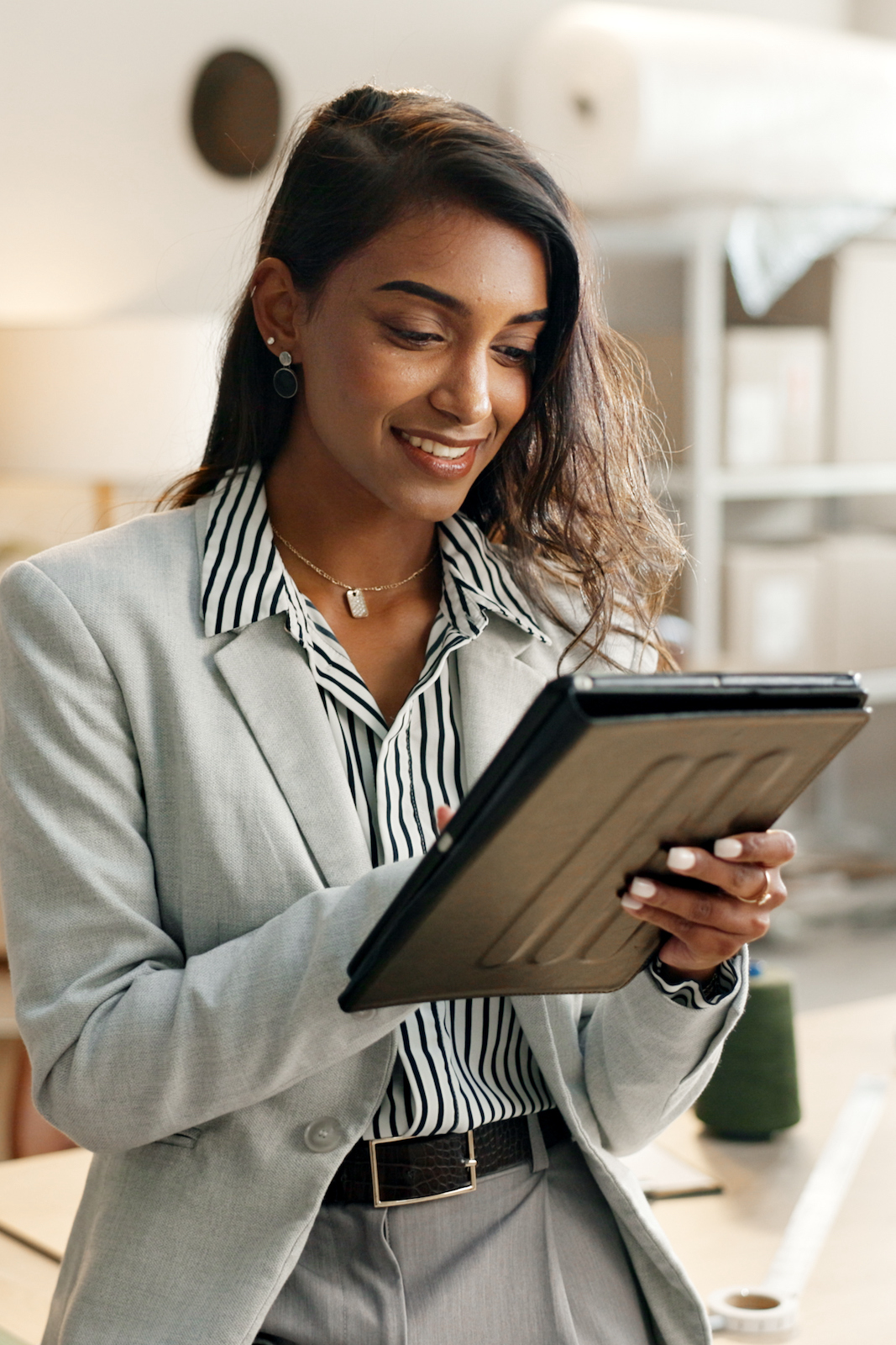 Small business, woman and tablet for e commerce, startup and inventory management of online shop, order or courier. Entrepreneur or Indian seller on digital technology for logistics, boxes or package